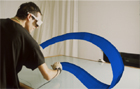 Hand motion is used to create surfaces on the Responsive Workbench.
